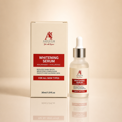 A bottle of Areesh Ayurveda Whitening Serum with a dropper cap stands next to its cream-colored retail box on a warm beige background with a soft reflection below.